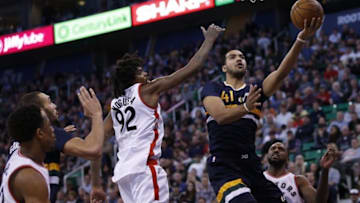 Dec 23, 2016; Salt Lake City, UT, USA; Utah Jazz forward Trey Lyles (41) drives to the hoop past Toronto Raptors center Lucas Nogueira (92) in the third quarter at Vivint Smart Home Arena. The Toronto Raptors defeated the Utah Jazz 104-98. Mandatory Credit: Jeff Swinger-USA TODAY Sports