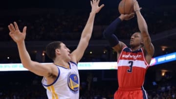 January 28, 2014; Oakland, CA, USA; Washington Wizards shooting guard Bradley Beal (3) shoots the ball against Golden State Warriors shooting guard Klay Thompson (11) during the first quarter at Oracle Arena. Mandatory Credit: Kyle Terada-USA TODAY Sports