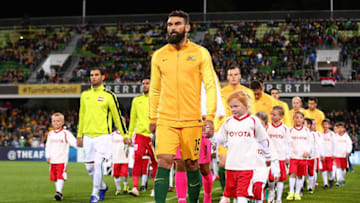 PERTH, AUSTRALIA - SEPTEMBER 01: Mile Jedinak of Australia and Saad Abdulameer of Iraq lead their teams out onto the field during the 2018 FIFA World Cup Qualifier match between the Australian Socceroos and Iraq at nib Stadium on September 1, 2016 in Perth, Australia. (Photo by Paul Kane/Getty Images)