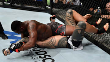 SINGAPORE - JUNE 23: (R-L) Ovince Saint Preux secures an arm bar submission against Tyson Pedro of Australia in their light heavyweight bout during the UFC Fight Night event at the Singapore Indoor Stadium on June 23, 2018 in Singapore. (Photo by Jeff Bottari/Zuffa LLC/Zuffa LLC via Getty Images)