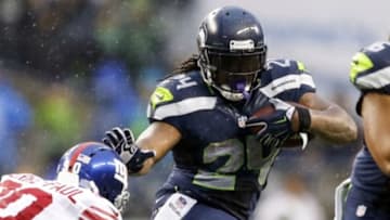 Nov 9, 2014; Seattle, WA, USA; Seattle Seahawks running back Marshawn Lynch (24) rushes against the New York Giants during the fourth quarter at CenturyLink Field. Mandatory Credit: Joe Nicholson-USA TODAY Sports
