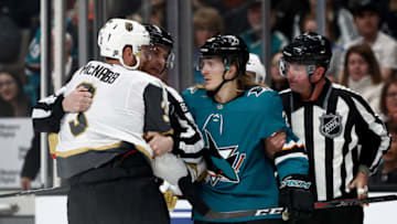 SAN JOSE, CALIFORNIA - MARCH 18: Brayden McNabb #3 of the Vegas Golden Knights and Marcus Sorensen #20 of the San Jose Sharks are held apart by referees at SAP Center on March 18, 2019 in San Jose, California. (Photo by Ezra Shaw/Getty Images)