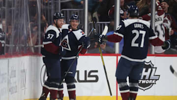 DENVER, COLORADO - NOVEMBER 07: J.T. Compher #37, Matt Nieto #83 and Ryan Graves #27 of the Colorado Avalanche celebrate a goal against the Nashville Predators at Pepsi Center on November 07, 2019 in Denver, Colorado. (Photo by Michael Martin/NHLI via Getty Images)