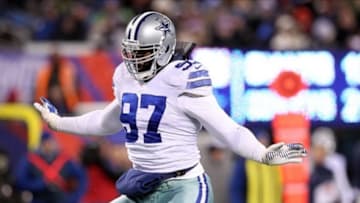 Nov 24, 2013; East Rutherford, NJ, USA; Dallas Cowboys defensive tackle Jason Hatcher (97) reacts after sacking New York Giants quarterback Eli Manning (not pictured) during the third quarter of a game at MetLife Stadium. The Cowboys defeated the Giants 24-21. Mandatory Credit: Brad Penner-USA TODAY Sports
