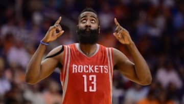 Feb 10, 2015; Phoenix, AZ, USA; Houston Rockets guard James Harden (13) points to the sky against the Phoenix Suns at US Airways Center. The Rockets won 127-118. Credit: Joe Camporeale-USA TODAY Sports
