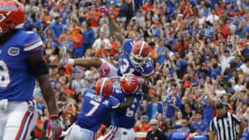 Oct 15, 2016; Gainesville, FL, USA; Florida Gators defensive back Quincy Wilson (6) is congratulated by defensive back Teez Tabor (31) and defensive back Duke Dawson (7) after he intercepted the ball and ran it back for a touchdown against the Missouri Tigers during the second quarter at Ben Hill Griffin Stadium. Mandatory Credit: Kim Klement-USA TODAY Sports