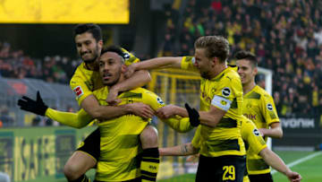 DORTMUND, GERMANY - NOVEMBER 25: Pierre-Emerick Aubameyang of Dortmund celebrates after scoring his team`s first goal with team mates during the Bundesliga match between Borussia Dortmund and FC Schalke 04 at Signal Iduna Park on November 25, 2017 in Dortmund, Germany. (Photo by TF-Images/TF-Images via Getty Images)