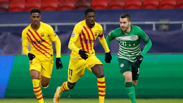 Junior Firpo and Ousmane Dembele of Barcelona. (Photo by Laszlo Szirtesi/Getty Images)