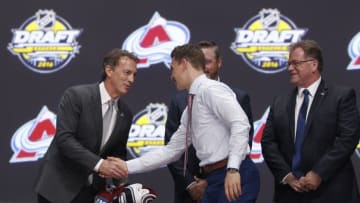 Jun 24, 2016; Buffalo, NY, USA; Tyson Jost shakes hands with Joe Sakic after being selected as the number ten overall draft pick by the Colorado Avalanche in the first round of the 2016 NHL Draft at the First Niagra Center. Mandatory Credit: Timothy T. Ludwig-USA TODAY Sports
