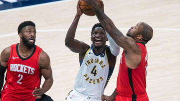 Indiana Pacers guard Victor Oladipo (4) shoots the ball while Houston Rockets forward P.J. Tucker (17) defends(Trevor Ruszkowski-USA TODAY Sports)