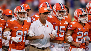 CLEMSON, SOUTH CAROLINA - OCTOBER 02: Head coach Dabo Swinney of the Clemson Tigers lines up with players before their game against the Boston College Eagles at Clemson Memorial Stadium on October 02, 2021 in Clemson, South Carolina. (Photo by Jacob Kupferman/Getty Images)