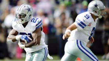 Oct 12, 2014; Seattle, WA, USA; Dallas Cowboys running back Joseph Randle (21) carries the ball against the Seattle Seahawks during the first half at CenturyLink Field. Mandatory Credit: Steven Bisig-USA TODAY Sports