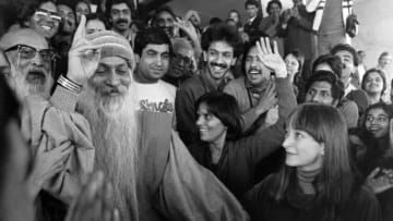 Rajneesh (1931 - 1990), popularly called Bhagwan (god) Rajneesh or Osho, the self styled sanyasi and founder of the Rajneesh movement, on his return to New Delhi, India, November 17, 1985 after being deported from America. (Photo by Sondeep Shankar/Getty Images)