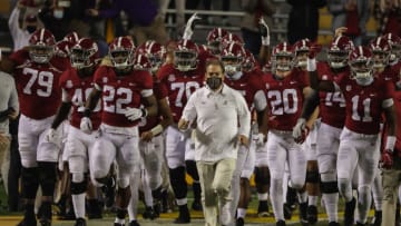 Alabama Crimson Tide head coach Nick Saban runs onto the field with his team prior to kickoff against the LSU Tigers at Tiger Stadium. Mandatory Credit: Derick E. Hingle-USA TODAY Sports