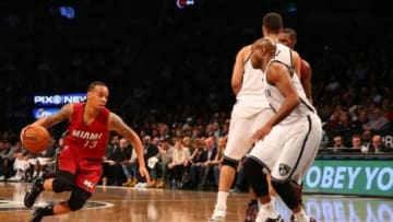 Nov 17, 2014; Brooklyn, NY, USA; Miami Heat guard Shabazz Napier (13) drives past Brooklyn Nets guard Jarrett Jack (0) during the first quarter at Barclays Center. Mandatory Credit: Anthony Gruppuso-USA TODAY Sports