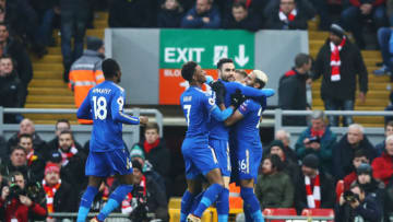 LIVERPOOL, ENGLAND - DECEMBER 30: Jamie Vardy of Leicester City (blocked) is mobbed by team mates including Demarai Gray, Vicente Iborra and Riyad Mahrez of Leicester City after scoring the first goal during the Premier League match between Liverpool and Leicester City at Anfield on December 30, 2017 in Liverpool, England. (Photo by Clive Brunskill/Getty Images)