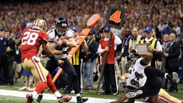 Feb 3, 2013; New Orleans, LA, USA; Baltimore Ravens kicker Justin Tucker (9) is tackled by San Francisco 49ers defensive back Darcel McBath (28) on a fake field goal in the second quarter in Super Bowl XLVII at the Mercedes-Benz Superdome. Mandatory Credit: Mark J. Rebilas-USA TODAY Sports