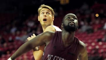 Dec 10, 2014; College Park, MD, USA; North Carolina Central Eagles forward Karamo Jawara (right) fights for a loose ball with Maryland Terrapins forward Jake Layman (left) in the first half at Xfinity Center. Mandatory Credit: Evan Habeeb-USA TODAY Sports