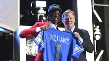 LAS VEGAS, NEVADA - APRIL 28: (L-R) Jameson Williams poses with NFL Commissioner Roger Goodell onstage after being selected 12th by the Detroit Lions during round one of the 2022 NFL Draft on April 28, 2022 in Las Vegas, Nevada. (Photo by David Becker/Getty Images)