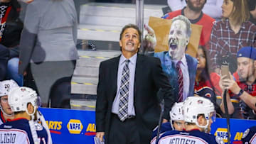 Feb 5, 2016; Calgary, Alberta, CAN; Fans hold a sign of Columbus Blue Jackets head coach John Tortorella on his bench during the game against the Calgary Flames at Scotiabank Saddledome. Mandatory Credit: Sergei Belski-USA TODAY Sports