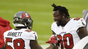 Nov 15, 2020; Charlotte, North Carolina, USA; Tampa Bay Buccaneers outside linebackers Jason Pierre-Paul (90) and Shaquil Barrett (58) on the sidelines in the third quarter at Bank of America Stadium. Mandatory Credit: Bob Donnan-USA TODAY Sports