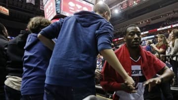 Nov 23, 2013; Washington, DC, USA; Washington Wizards point guard John Wall (2) shakes hands with fans after the Wizards game against the New York Knicks at Verizon Center. The Wizards won 98-89. Mandatory Credit: Geoff Burke-USA TODAY Sports