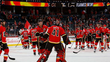 CALGARY, AB - FEBRUARY 18: Mike Smith #41 of the Calgary Flames celebrates with teammates after a win against the Arizona Coyotes at Scotiabank Saddledome on February 18, 2019 in Calgary, Alberta, Canada. (Photo by Gerry Thomas/NHLI via Getty Images)