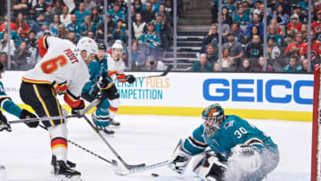 SAN JOSE, CA - MARCH 31: Calgary Flames defenseman Dalton Prout (6) carries the puck at San Jose Sharks goaltender Aaron Dell (30) during the San Jose Sharks game versus the Calgary Flames on March 31, 2019, at SAP Center at San Jose in San Jose, CA." (Photo by Matt Cohen/Icon Sportswire via Getty Images)