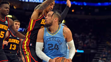 MEMPHIS, TENNESSEE - NOVEMBER 26: Dillon Brooks #24 of the Memphis Grizzlies handles the ball against John Collins #20 of the Atlanta Hawks during the second half at FedExForum on November 26, 2021 in Memphis, Tennessee. NOTE TO USER: User expressly acknowledges and agrees that, by downloading and or using this photograph, User is consenting to the terms and conditions of the Getty Images License Agreement. (Photo by Justin Ford/Getty Images)