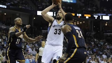 Mar 22, 2014; Memphis, TN, USA; Memphis Grizzlies center Marc Gasol (33) shoots over Indiana Pacers forward Paul George (24) during the game at FedExForum. Memphis Grizzlies defeat the Indiana Pacers 82 - 71. Mandatory Credit: Justin Ford-USA TODAY Sports