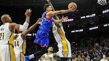 Jan 10, 2015; Philadelphia, PA, USA; Philadelphia 76ers guard Michael Carter-Williams (1) shoots the game-winning shot during the fourth quarter at the Wells Fargo Center. The Sixers won the game 93-92. Mandatory Credit: John Geliebter-USA TODAY Sports