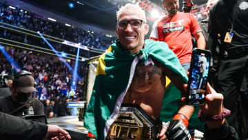 LAS VEGAS, NEVADA - DECEMBER 11: Charles Oliveira of Brazil celebrates after defeating Dustin Poirier to defend his lightweight title during the UFC 269 event at T-Mobile Arena on December 11, 2021 in Las Vegas, Nevada. (Photo by Carmen Mandato/Getty Images)