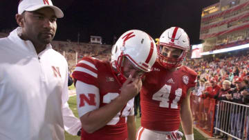 Nov 24, 2017; Lincoln, NE, USA; Nebraska Cornhuskers kicker Drew Brown (34) reacts as he leaves the field with fullback Luke McNitt (41) after the game against the Iowa Hawkeyes at Memorial Stadium. Iowa won 56-14. Mandatory Credit: Bruce Thorson-USA TODAY Sports