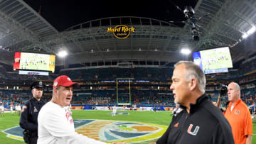 MIAMI GARDENS, FL - DECEMBER 30: Head coach Paul Chryst of the Wisconsin Badgers shakes hands with head coach Mark Richt of the Miami Hurricanes after the 2017 Capital One Orange Bowl at Hard Rock Stadium on December 30, 2017 in Miami Gardens, Florida. (Photo by Rob Foldy/Getty Images)