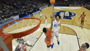 CHICAGO, ILLINOIS - MARCH 27: Jalen Wilson #10 of the Kansas Jayhawks shoots the ball against Jordan Miller #11 of the Miami Hurricanes during the first half in the Elite Eight round game of the 2022 NCAA Men's Basketball Tournament at United Center on March 27, 2022 in Chicago, Illinois. (Photo by Quinn Harris/Getty Images)