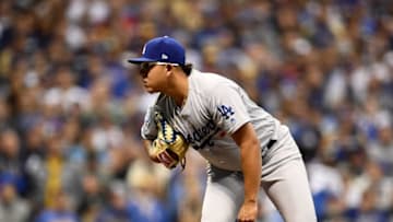 MILWAUKEE, WI - OCTOBER 20: Julio Urias #7 of the Los Angeles Dodgers looks to throw a pitch against the Milwaukee Brewers during the fifth inning in Game Seven of the National League Championship Series at Miller Park on October 20, 2018 in Milwaukee, Wisconsin. (Photo by Stacy Revere/Getty Images)