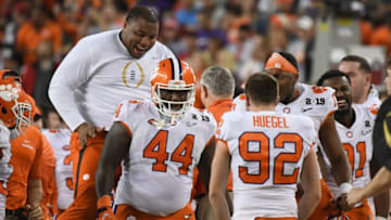 SANTA CLARA, CA - JANUARY 07: Dexter Lawrence of the Clemson Tigers congratulates Nyles Pinckney #44 fourth down tackle on a fake field goal during the second half against the Alabama Crimson Tide in the CFP National Championship presented by AT&T at Levi's Stadium on January 7, 2019 in Santa Clara, California. (Photo by Thearon W. Henderson/Getty Images)