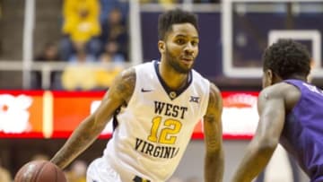 Feb 13, 2016; Morgantown, WV, USA; West Virginia Mountaineers guard Tarik Phillip (12) dribbles the ball during the second half against the TCU Horned Frogs at the WVU Coliseum. Mandatory Credit: Ben Queen-USA TODAY Sports