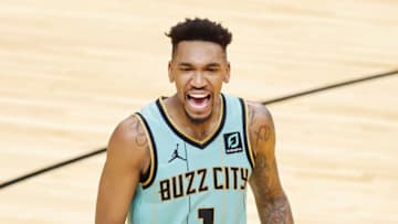 MIAMI, FLORIDA - FEBRUARY 01: Malik Monk #1 of the Charlotte Hornets celebrates after a basket against the Miami Heat during overtime at American Airlines Arena on February 01, 2021 in Miami, Florida. NOTE TO USER: User expressly acknowledges and agrees that, by downloading and or using this photograph, User is consenting to the terms and conditions of the Getty Images License Agreement. (Photo by Michael Reaves/Getty Images)
