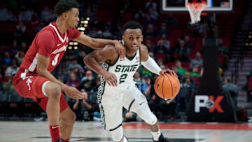 Nov 24, 2022; Portland, Oregon, USA; Michigan State Spartans guard Tyson Walker (2) drives to the basket during the first half against Alabama Crimson Tide guard Rylan Griffen (3) at Moda Center. Mandatory Credit: Troy Wayrynen-USA TODAY Sports