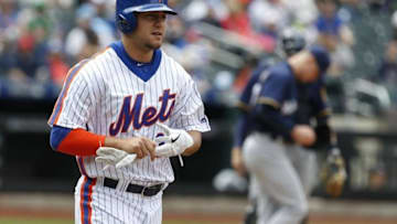 May 22, 2016; New York City, NY, USA; New York Mets left fielder Michael Conforto (30) goes to first base after a walk in the fourth inning against the Milwaukee Brewers at Citi Field. Mandatory Credit: Noah K. Murray-USA TODAY Sports