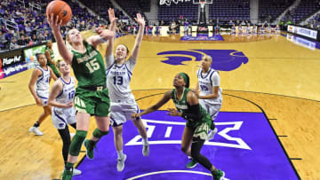 MANHATTAN, KS - FEBRUARY 13: Lauren Cox #15 of the Baylor Bears drives in for a basket past Laura Macke #13 of the Kansas State Wildcats during the second half on February 13, 2019 at Bramlage Coliseum in Manhattan, Kansas. (Photo by Peter G. Aiken/Getty Images)
