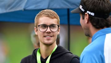 CHARLOTTE, NC - AUGUST 08: Musician Justin Bieber looks on with Bubba Watson of the United States during a practice round prior to the 2017 PGA Championship at Quail Hollow Club on August 8, 2017 in Charlotte, North Carolina. (Photo by Stuart Franklin/Getty Images)