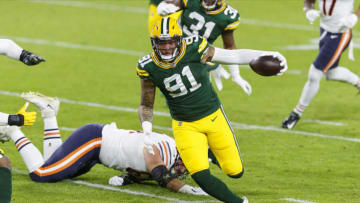 Nov 29, 2020; Green Bay, Wisconsin, USA; Green Bay Packers outside linebacker Preston Smith (91) returns a fumble recovery for a touchdown during the second quarter against the Chicago Bears at Lambeau Field. Mandatory Credit: Jeff Hanisch-USA TODAY Sports