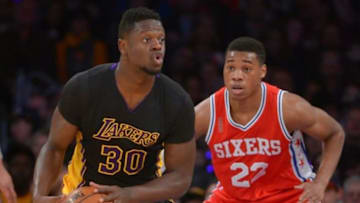 Jan 1, 2016; Los Angeles, CA, USA; Philadelphia 76ers forward Richaun Holmes (22) guards Los Angeles Lakers forward Julius Randle (30) in the first half of the game at Staples Center. Mandatory Credit: Jayne Kamin-Oncea-USA TODAY Sports