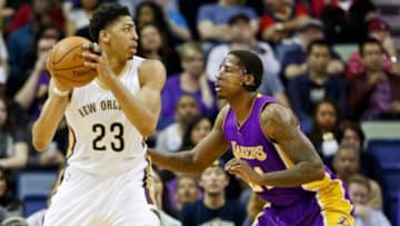 Jan 21, 2015; New Orleans, LA, USA; New Orleans Pelicans forward Anthony Davis (23) is guarded by Los Angeles Lakers forward Ed Davis (21) during the first quarter of a game at the Smoothie King Center. Mandatory Credit: Derick E. Hingle-USA TODAY Sports