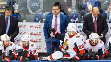 TORONTO, ON - OCTOBER 2: Head Coach D.J. Smith of the Ottawa Senators looks on from the bench during an NHL game against the Toronto Maple Leafs during the first period at the Scotiabank Arena on October 2, 2019 in Toronto, Ontario, Canada. (Photo by Kevin Sousa/NHLI via Getty Images)