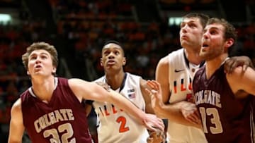 NOVEMBER 09, 2012; Champaign, IL, USA: Colgate Raiders players Matt McMullen (32) and Murphy Burnatowski (13) box out Illinois Fighting Illini players Joseph Bertrand (2) and Tyler Griffey (42) for a rebound at Assembly Hall. Mandatory Credit: Ben Woloszyn-USA TODAY Sports