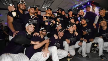 DENVER, CO - SEPTEMBER 26: The Colorado Rockies pose for a group photo in the clubhouse after defeating the Washington Nationals 5-2 earning themselves a playoff birth at Coors Field September 28, 2018. (Photo by Andy Cross/The Denver Post via Getty Images)