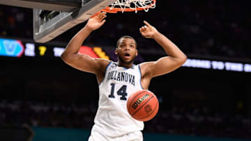 SAN ANTONIO, TX - MARCH 31: Omari Spellman #14 of the Villanova Wildcats dunks against the Kansas Jayhawks during the second half in the 2018 NCAA Men's Final Four semifinal game at the Alamodome on March 31, 2018 in San Antonio, Texas. (Photo by Jamie Schwaberow/NCAA Photos via Getty Images)